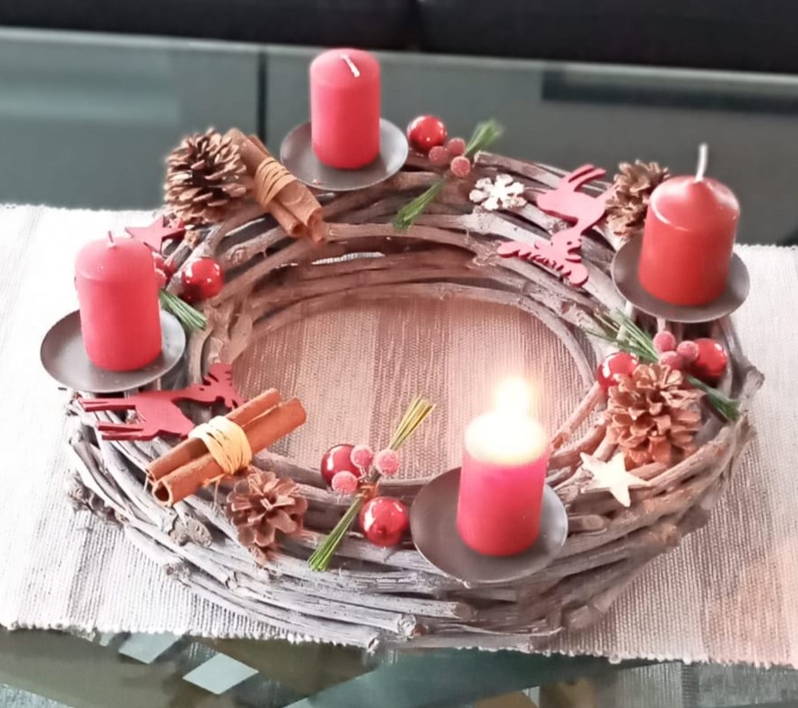 German Advent Wreath - with one burning candle for the first Advent.